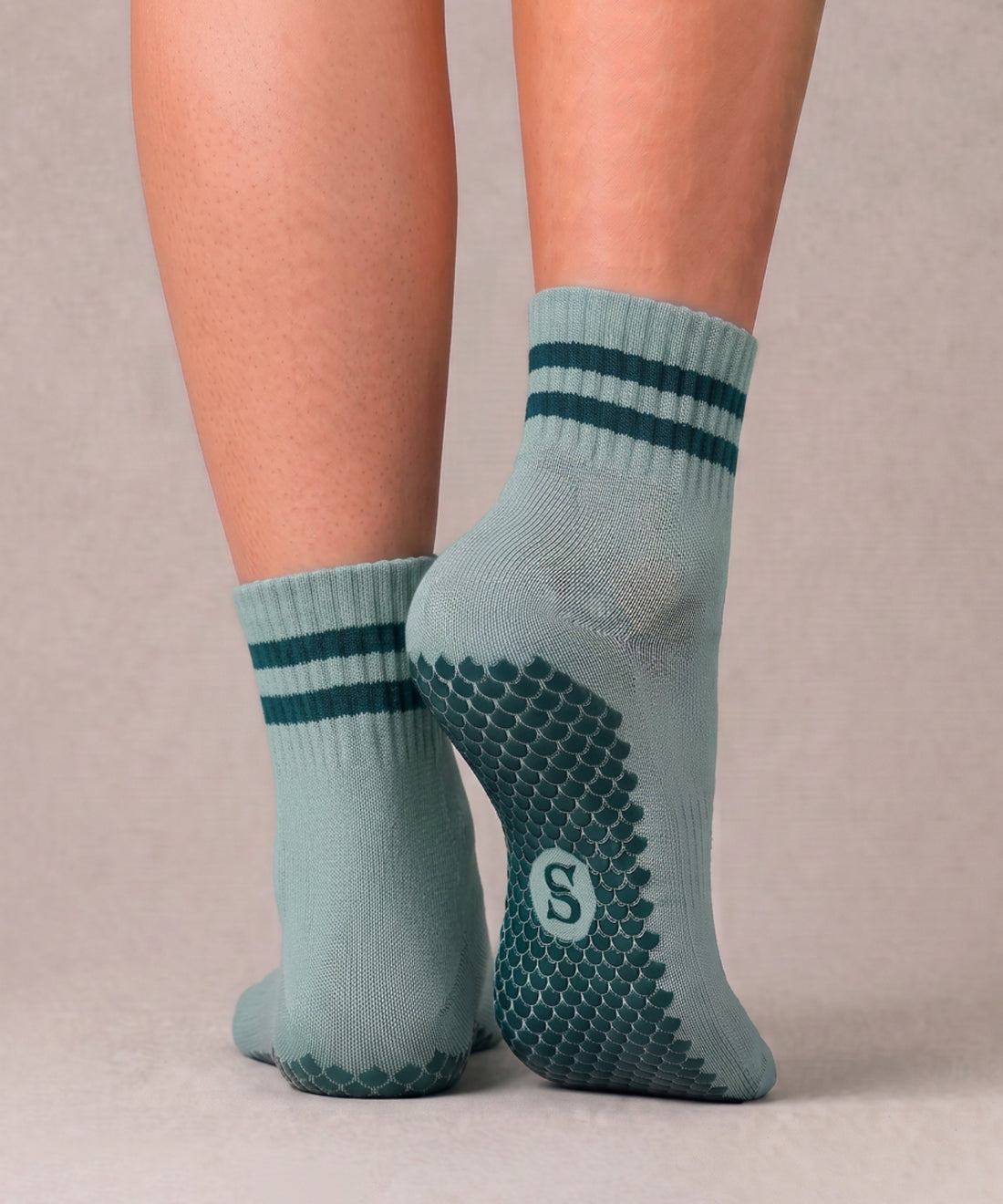 SIREN Seafoam Grip Sock in seafoam green, worn on feet.