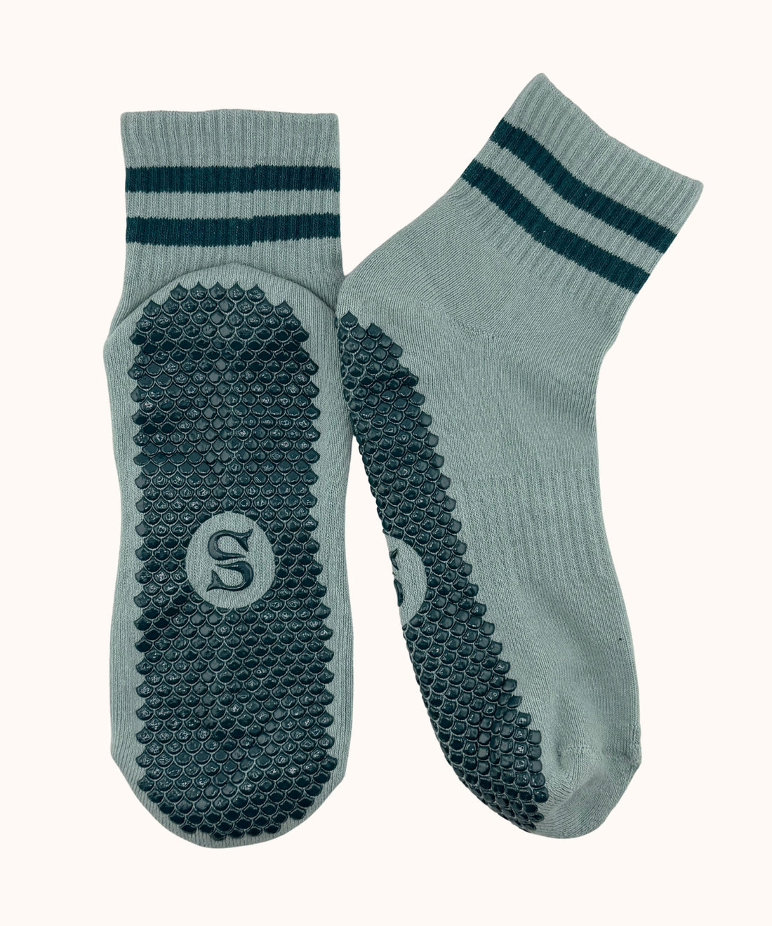 SIREN Seafoam Grip Sock in seafoam green, a pair laid flat, showing the Mermaid Sole™ grip.