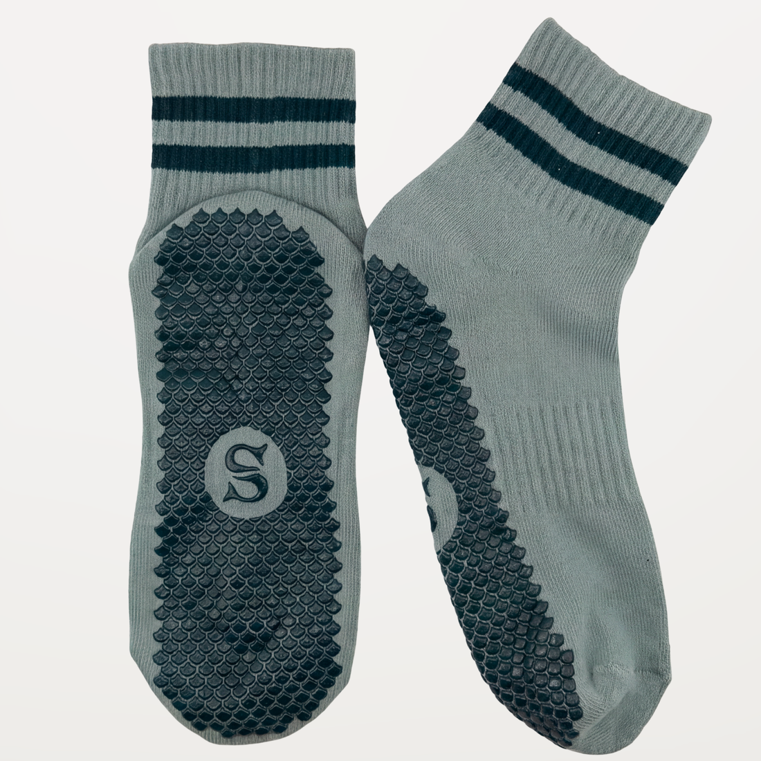 Wide shot of the SIREN Seafoam Grip Sock in seafoam green by SOLEMETHOD.