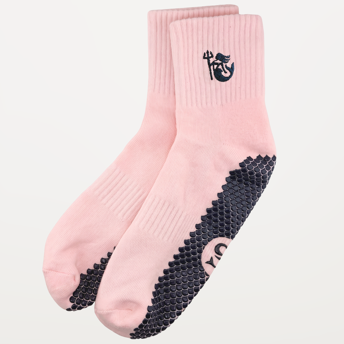 Wide shot of a pair of SIREN Warrior Grip Socks in Seashell by SOLEMETHOD.