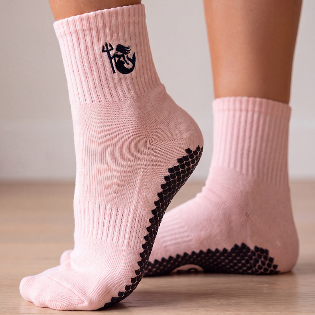 SIREN Warrior Grip Socks in Seashell worn on both feet, for Pilates, Lagree and Barre.