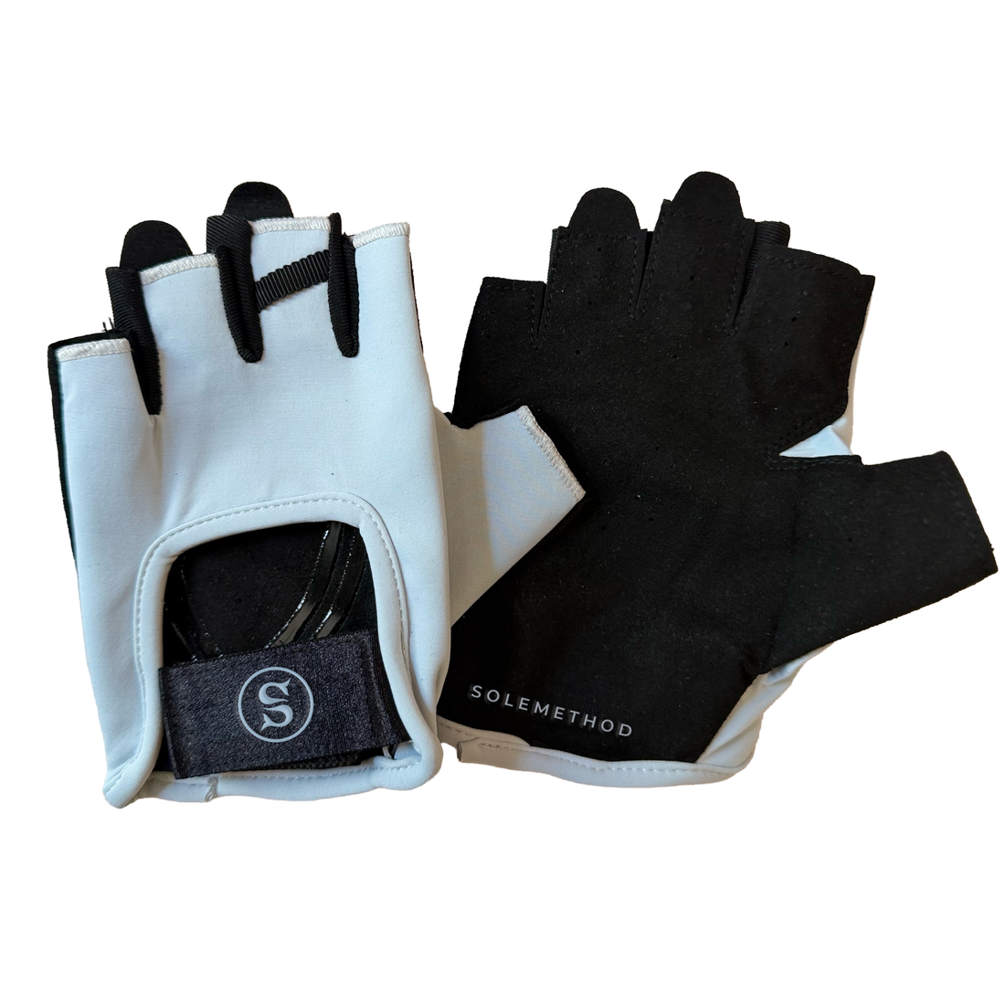 SIREN Grip Gloves in Sky, an off-white fingerless glove with black palm and fingertips and a black wrist strap featuring the circular SOLEMETHOD S logo.